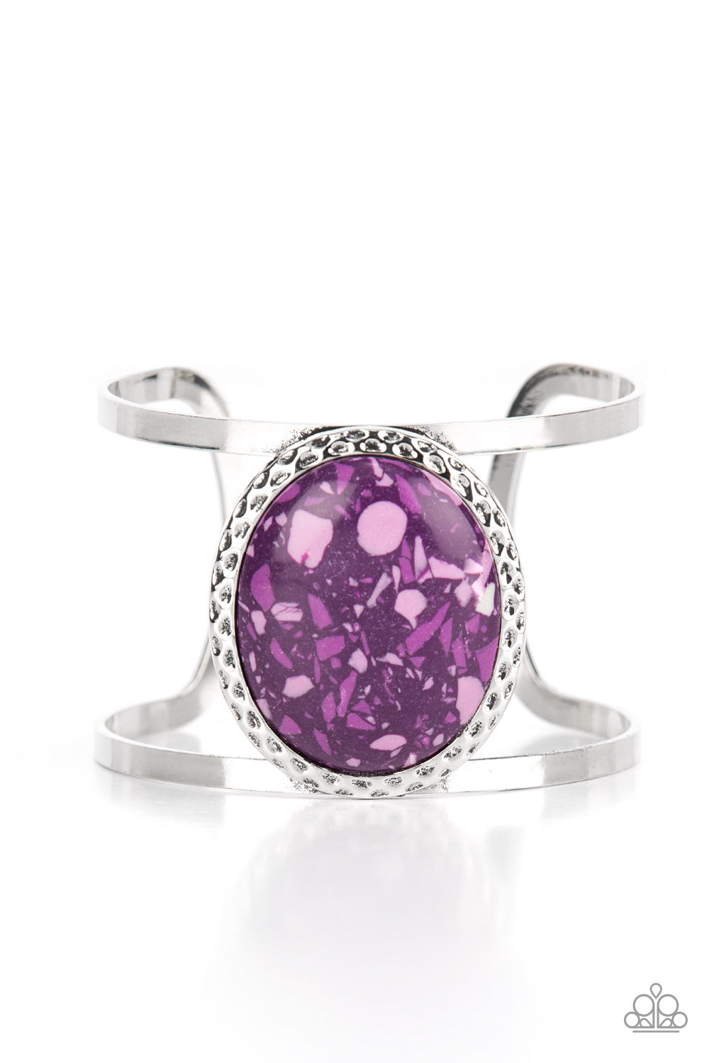 oversized purple stone is pressed into the center of a hammered silver frame