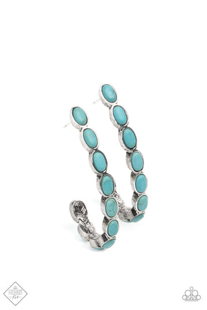 Small turquoise stones pressed into simple silver oval frames stack end to end as they fall from the ear and delicately curve into a J-shaped hoop