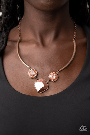 oversized collection of coppery aurum and glassy coppery gems delicately link at the bottom of two curved copper rods