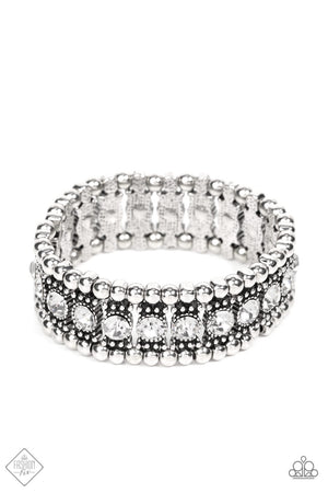 A dazzling row of sparkling white rhinestones set in dotted frames is bordered by a row of dainty antiqued silver studs