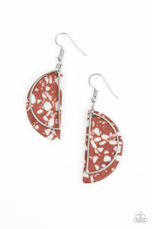 A faux Adobe stone semicircle disc, flecked with white accents, is outlined with a dainty silver half moon frame swaying in front for a flashy fad-inspired fashion