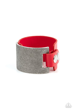 curved tin finished silver panel, coated in antiqued texture, attaches to a wide red leather band with silver snaps