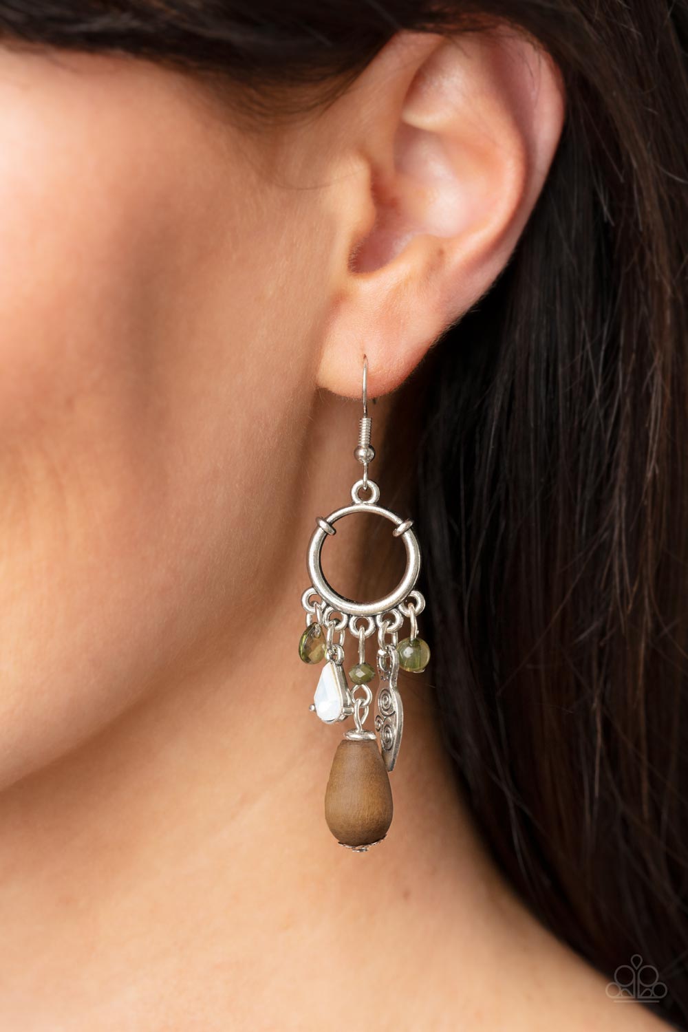 earthy compilation of wooden teardrop beads, dainty Olive Branch and opal crystal-like accents, and mismatched silver accents cascade from the bottom of a dainty silver hoop