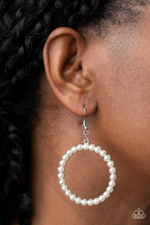 Bubbly white pearls adorn the front of a textured silver hoop