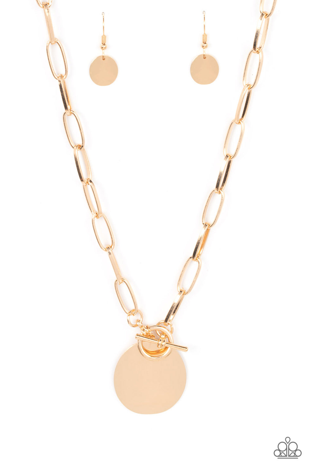 oversized oval gold disc swings from the bottom of a substantial oval linked gold chain