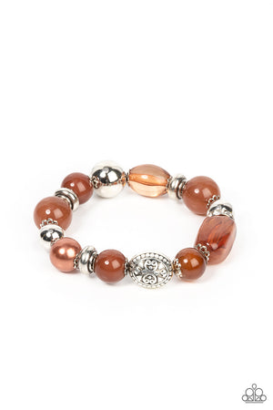 enchanting assortment of silver beads and white rhinestone encrusted silver rings join an opaque, glassy, and pearly assortment of Root Beer beads along a stretchy band 