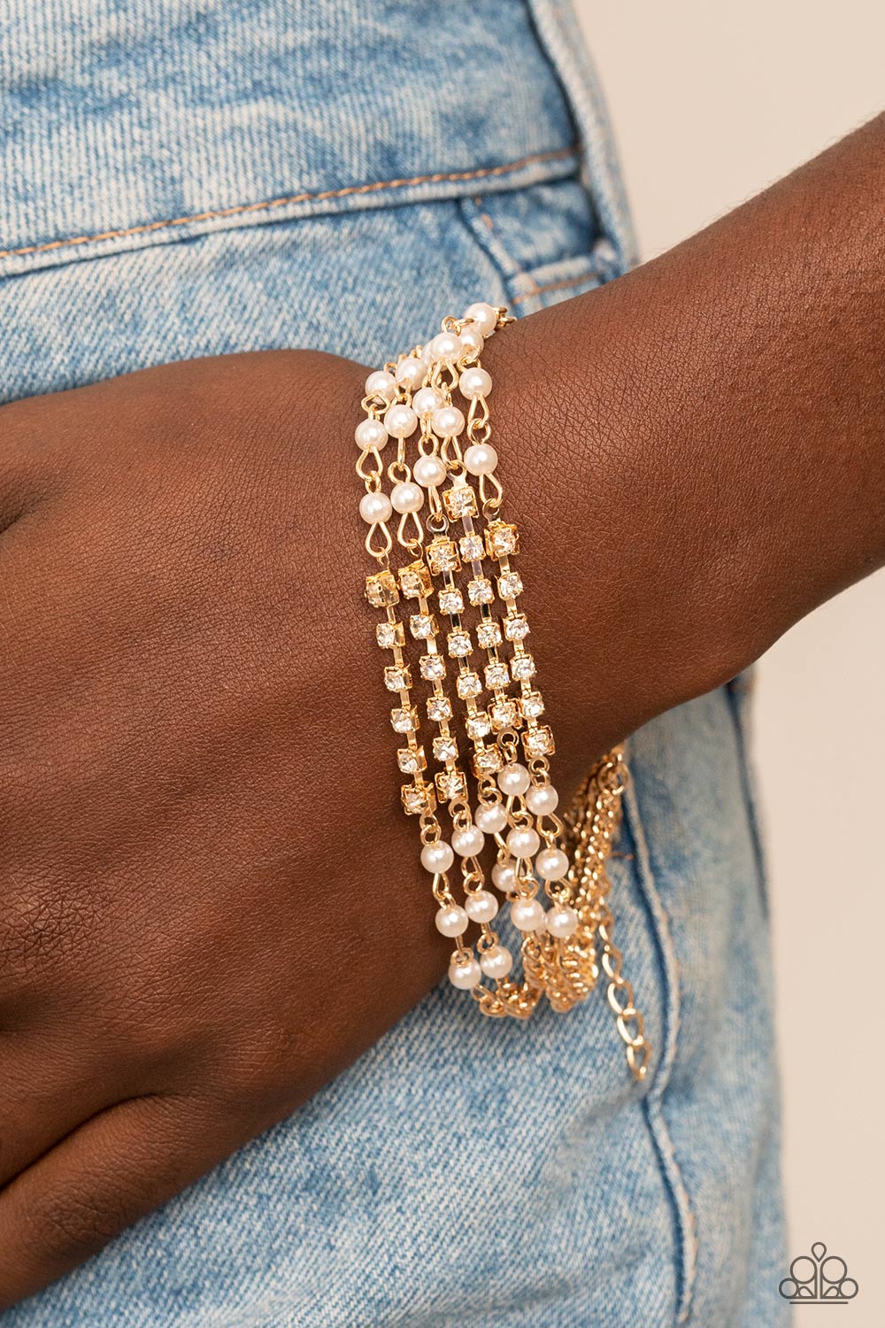  white rhinestone encrusted gold fittings, sections of dainty white pearls and glassy white rhinestones