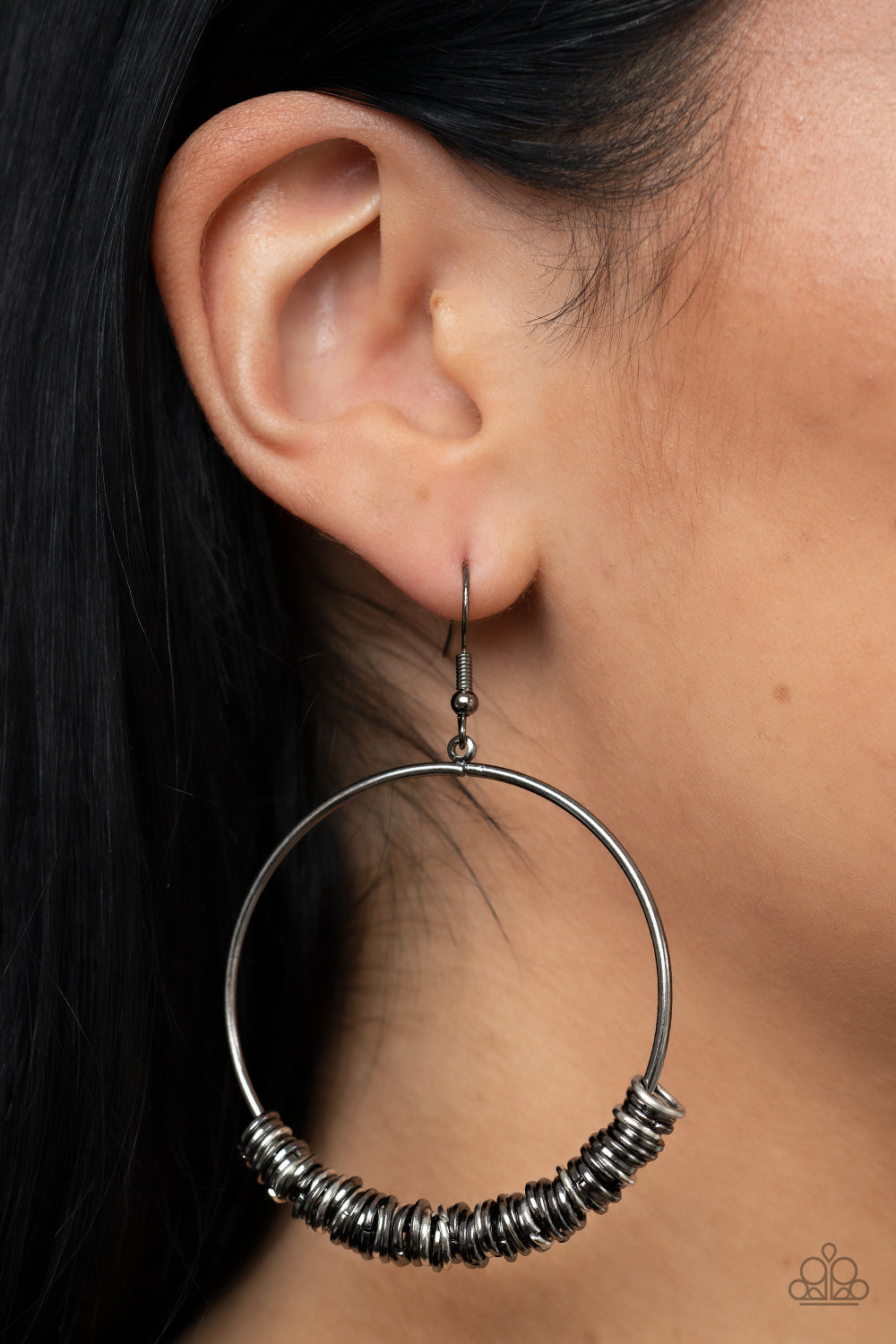 miniature gunmetal and silver rings slide around a simple gunmetal front-facing hoop