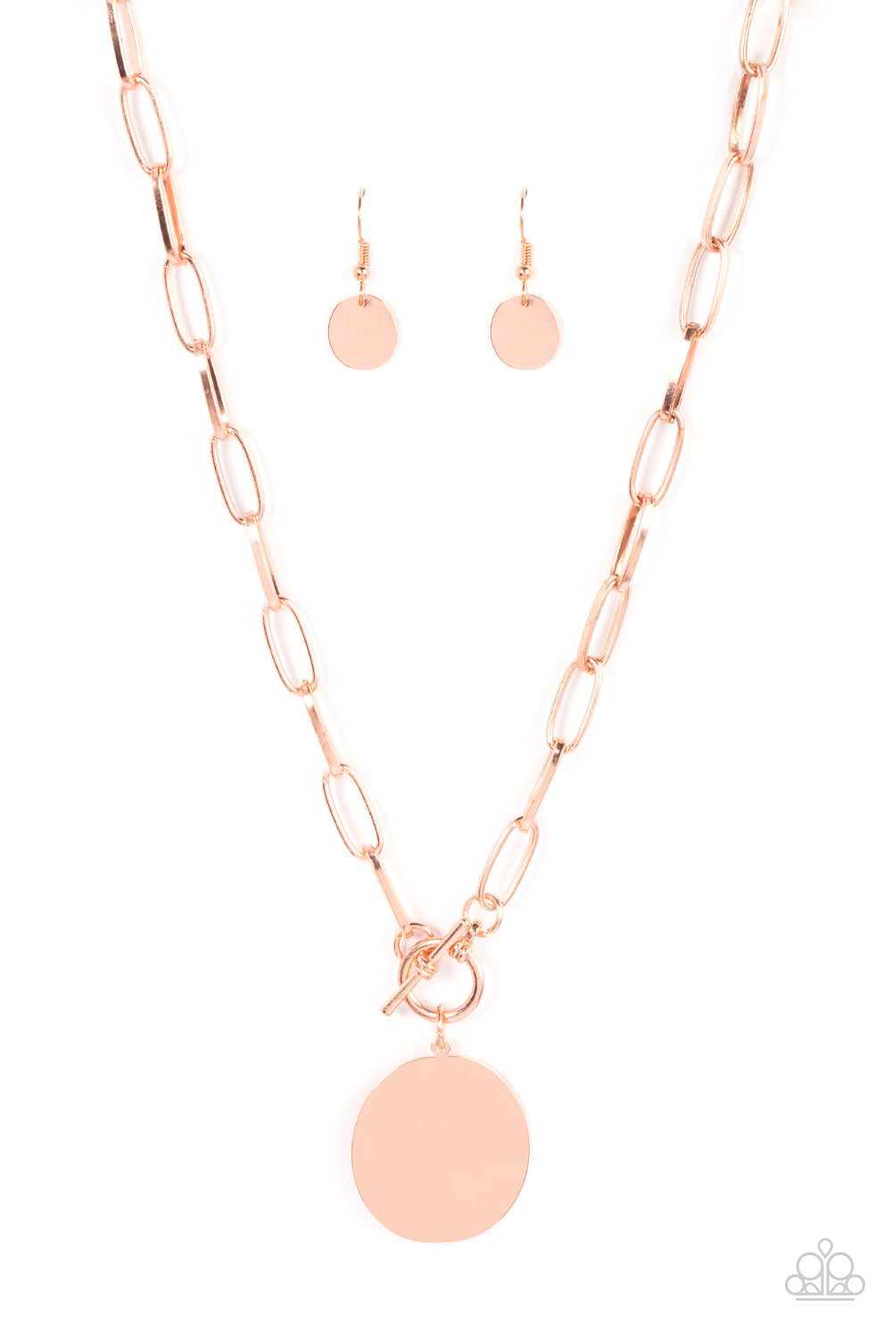 An oversized oval shiny copper disc swings from the bottom of a substantial oval linked shiny copper chain