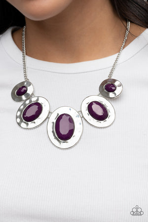Gradually increasing in size, hammered silver oval frames are dotted with faceted plum beads as they delicately link below the collar