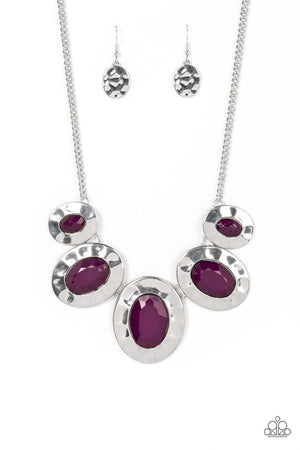 Gradually increasing in size, hammered silver oval frames are dotted with faceted plum beads as they delicately link below the collar