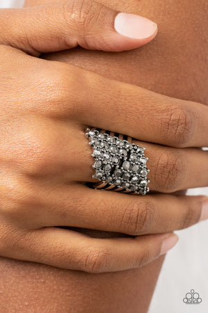 layered silver bands, rows of silver pronged hematite rhinestones slant and scatter across the finger