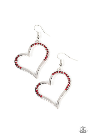 A curvaceous silver heart is encrusted in sections of fiery red rhinestones