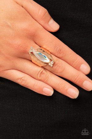 iridescent gem asymmetrically balances between two flared and hammered rose gold frames
