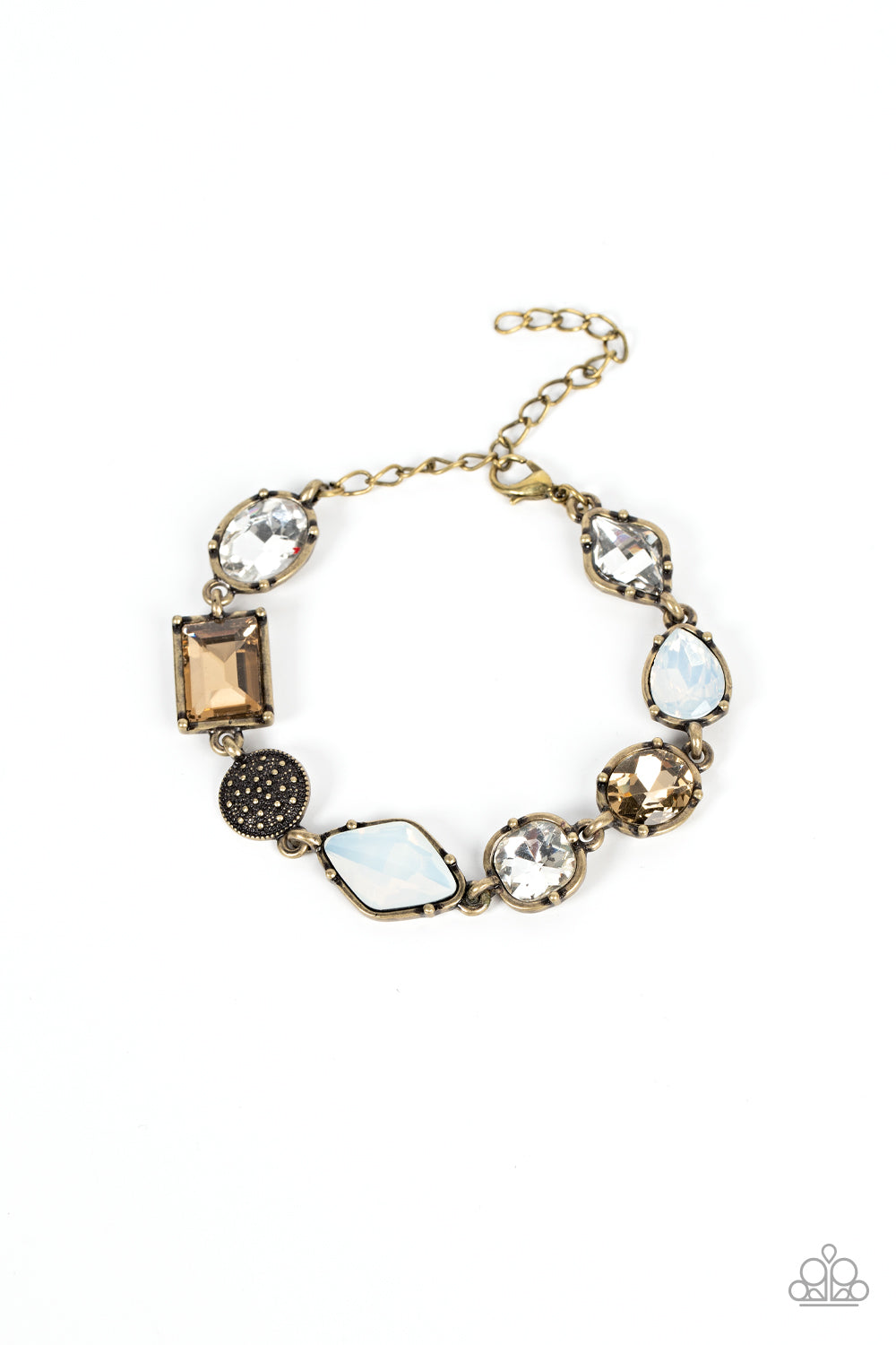 Encased in pronged brass fittings, a mismatched collection of brassy, white, and opal rhinestones delicately links with a studded brass frame around the wrist
