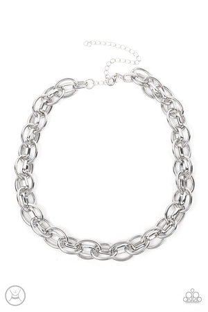 oversized silver chain interlocks with an oval linked chain