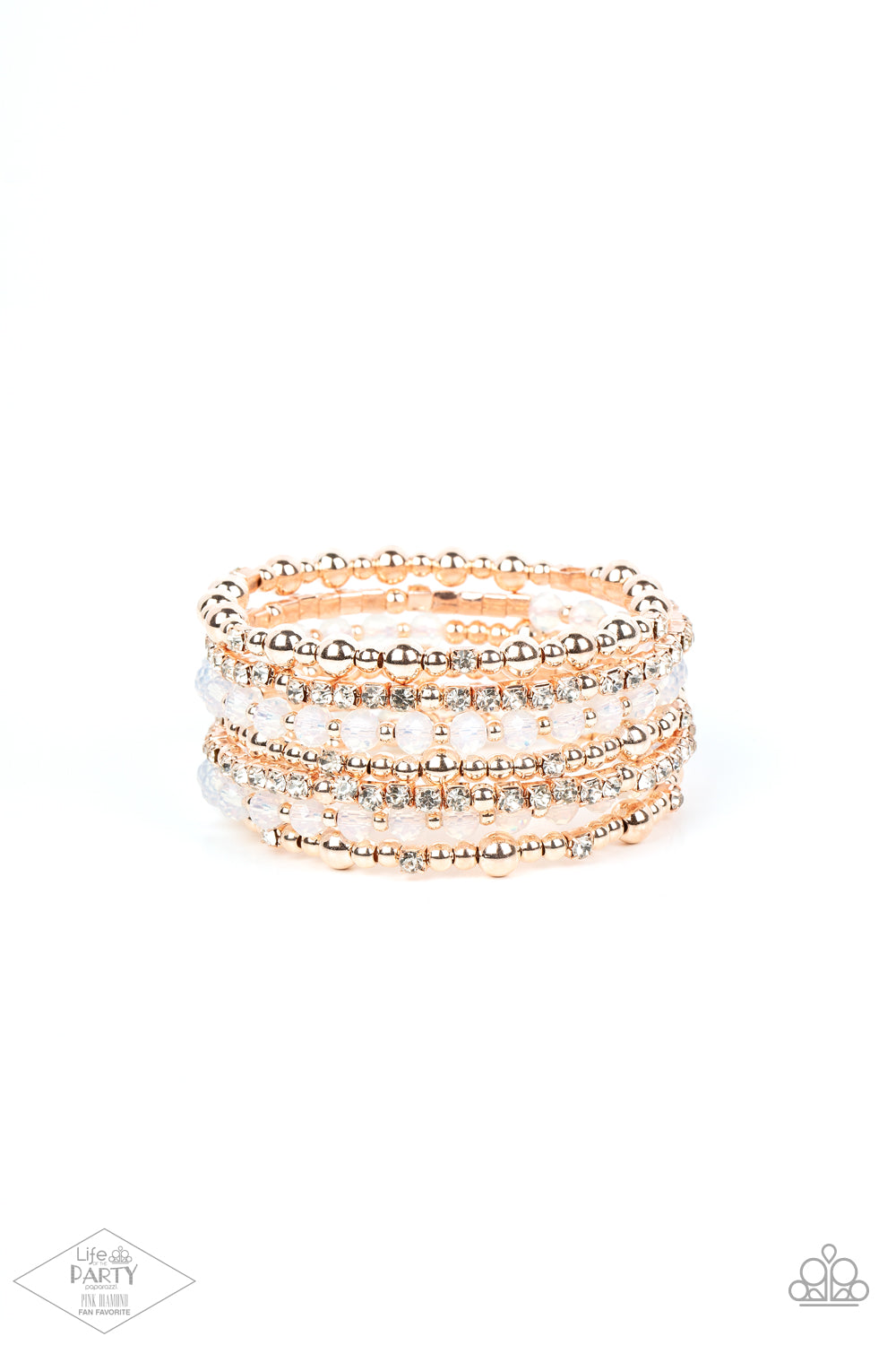rose gold beads, rose gold cubes, opaque crystals, and glassy white rhinestones are threaded along a coiled wire
