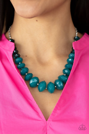 Separated by dainty silver beads, glassy Harbor Blue crystal-like beads gradually morph into opaque Harbor Blue crystal-like beads below the collar