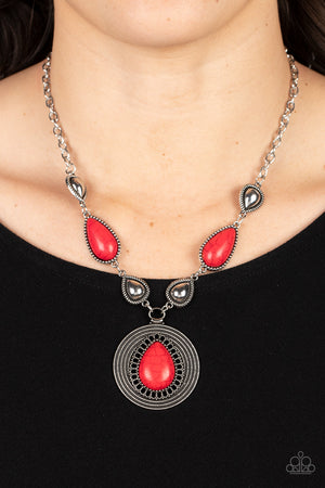 shiny silver teardrops alternate with red stone frames at the bottom of a silver chain