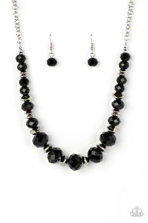 silver discs and faceted silver accents, faceted black crystal-like gems are threaded along an invisible wire below the collar