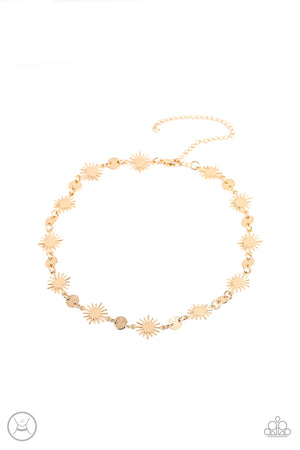 Dainty gold discs delicately alternate with starry gold sunbursts