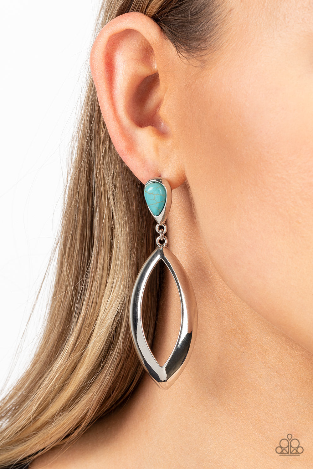 sleek silver fitting, a teardrop turquoise stone gives way to a beveled silver teardrop frame 