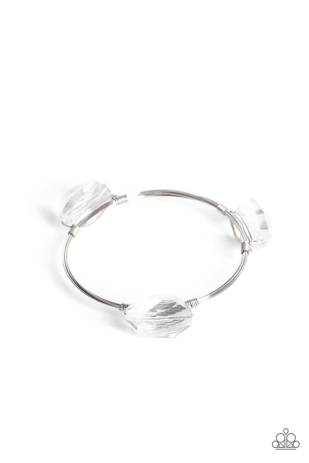 glassy shimmer, oversized faceted gems are wrapped in place along the front of coiled silver wires that join into a solitaire bangle around the wrist