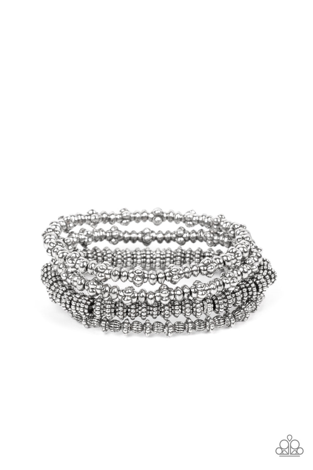 antiqued assortment of studded, round, and decorative silver beads are threaded along stretchy bands around the wrist