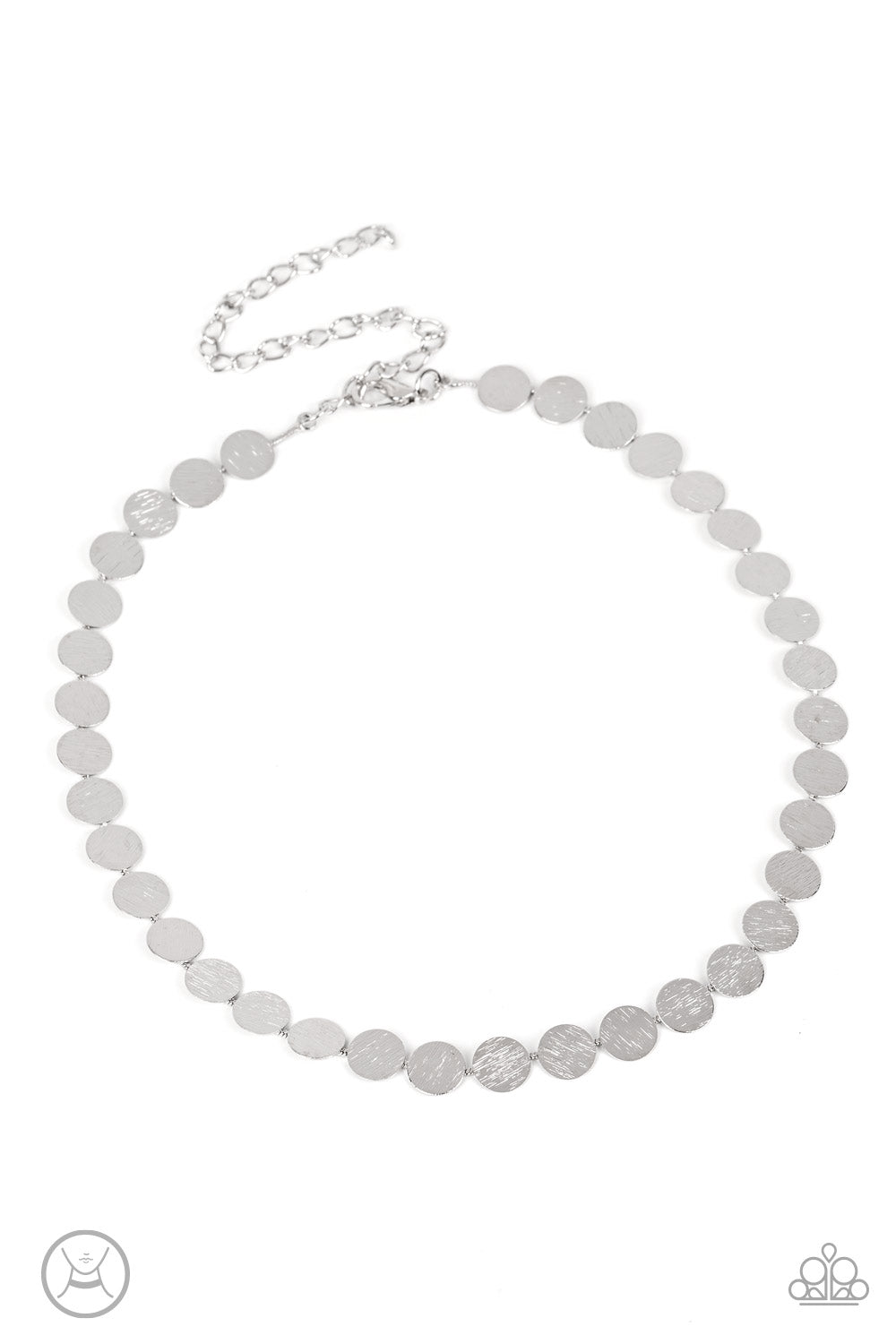 Delicately scratched in blinding shimmer, a row of dainty silver discs shines around the neck
