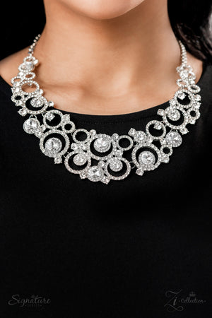 circular silver frames are encrusted in shimmery white rhinestones and link together to create a dizzying display along the collar