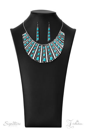 Elongated silver plates featuring a high sheen finish fan out unapologetically along the collar, graduating in size as they lead down to the center Oval-shaped turquoise stones,