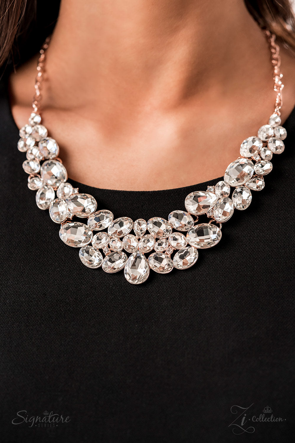 Oversized white rhinestones with exaggerated faceted surfaces gather into glittery clusters along the collar