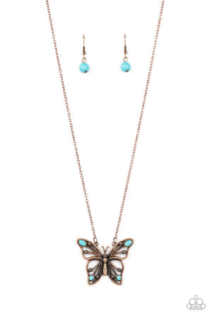 oval turquoise stones, a decorative copper butterfly flutters at the bottom of a copper chain