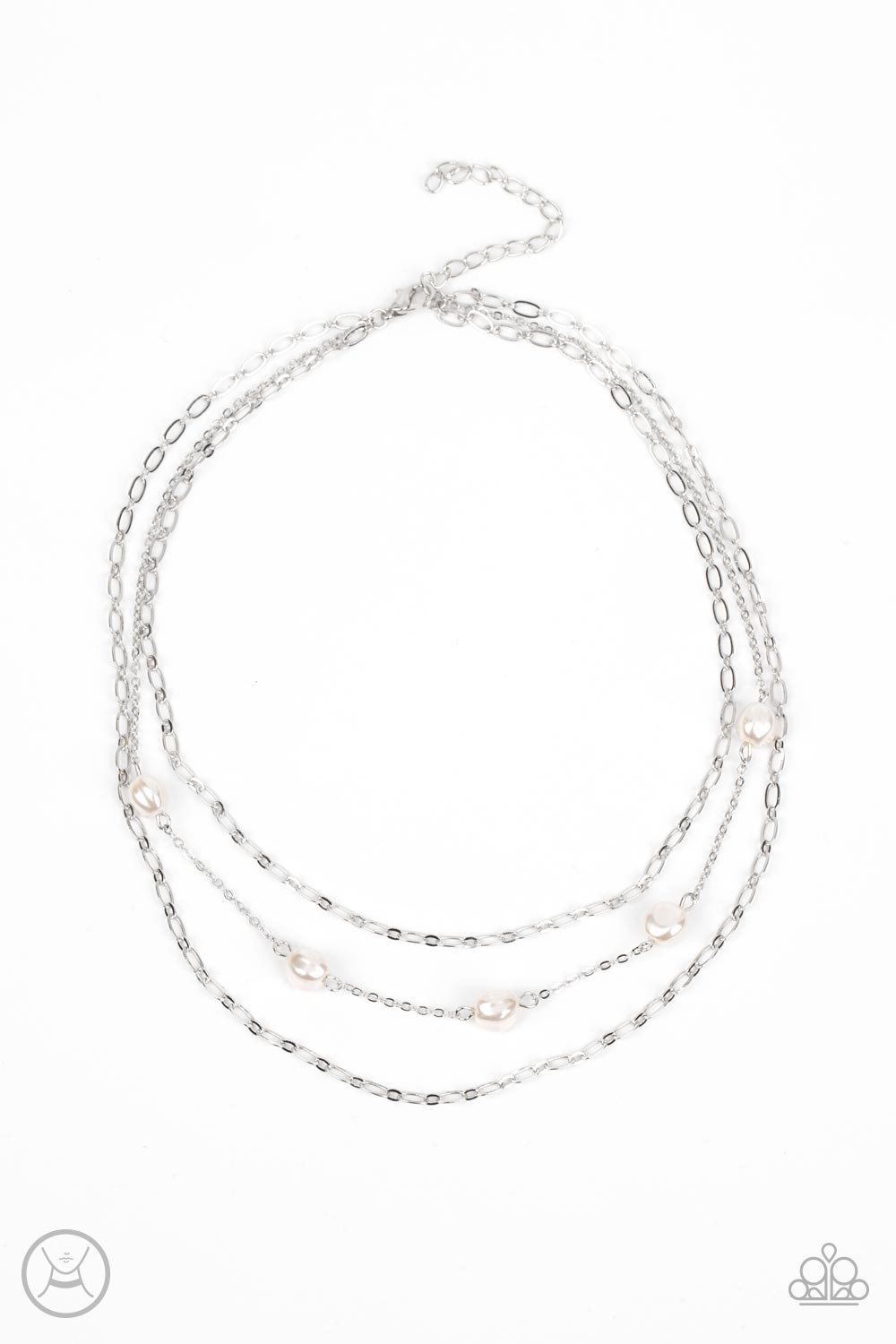 Infused with two oval-linked silver chains, imperfect white pearls adorn a dainty silver chain around the neck