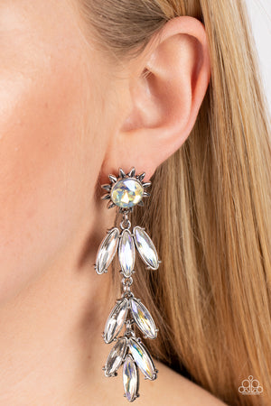 silver sunburst frame wraps around a yellow iridescent gem as it gives way to an explosion of marquise-cut rhinestones