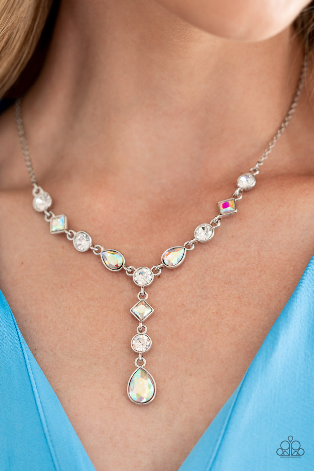 Brilliant white round-cut rhinestones alternate between diamonds and teardrops with an iridescent finish